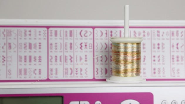 Spools of metallic thread should unwind from off the side