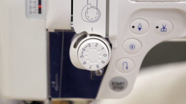 A sewing machine's top tension settings