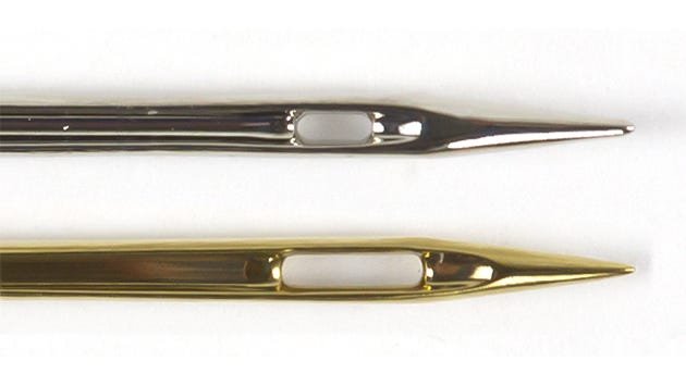 The difference between a Universal needle (top) and Topstitch needle (bottom)