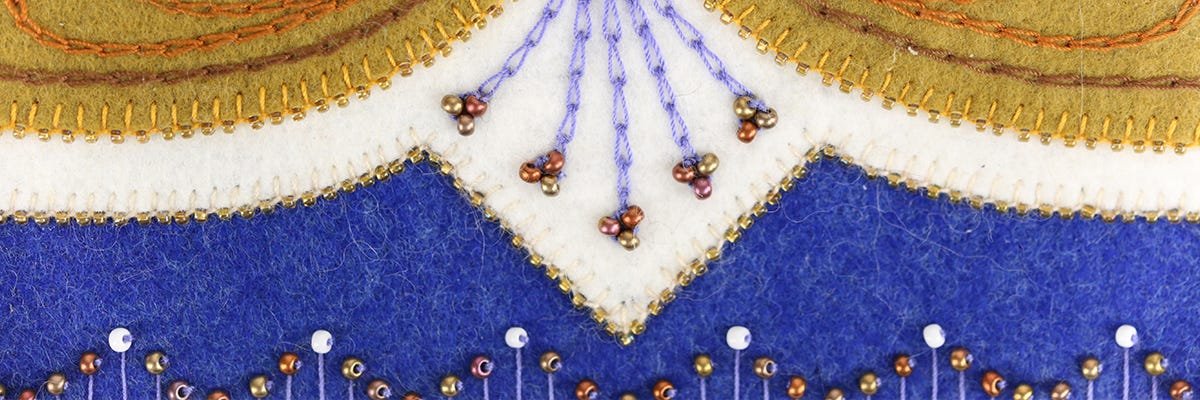 Wool applique with beads