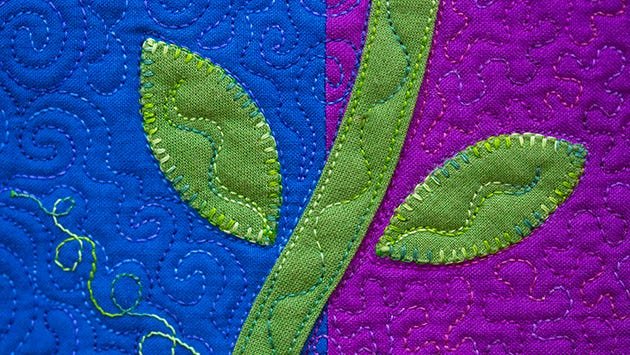 The leaves on this quilt were placed with fusible thread
